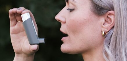 woman using inhaler