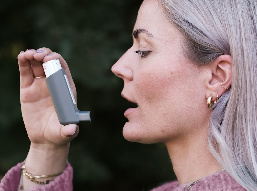 woman using inhaler