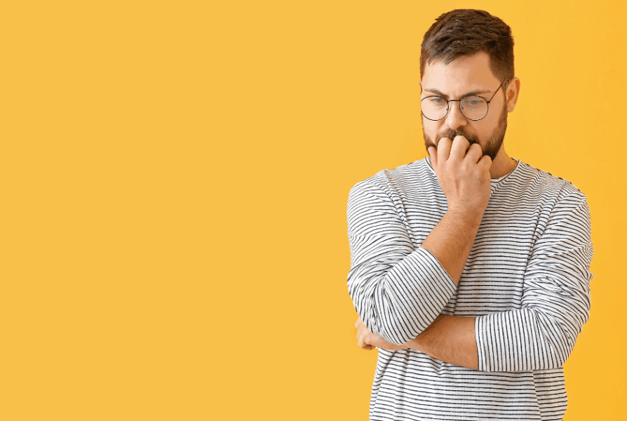 Middle-aged man thinking about a health check, representing Men’s Health Month awareness in Neath, South Wales.